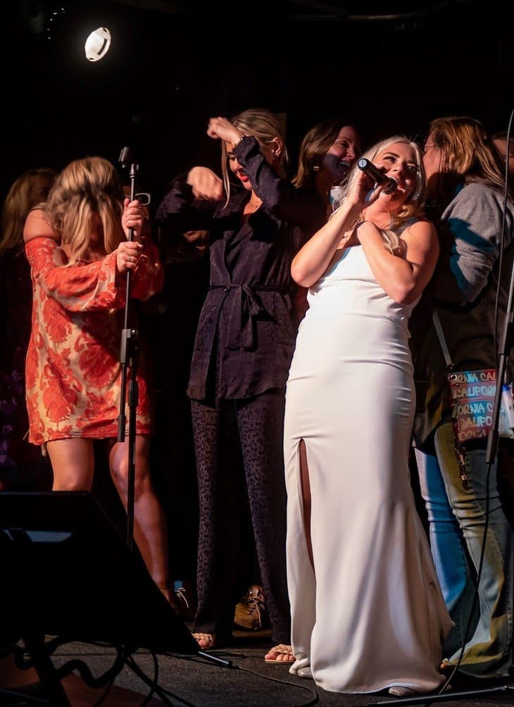 Wedding guests enjoying live band karaoke entertainment