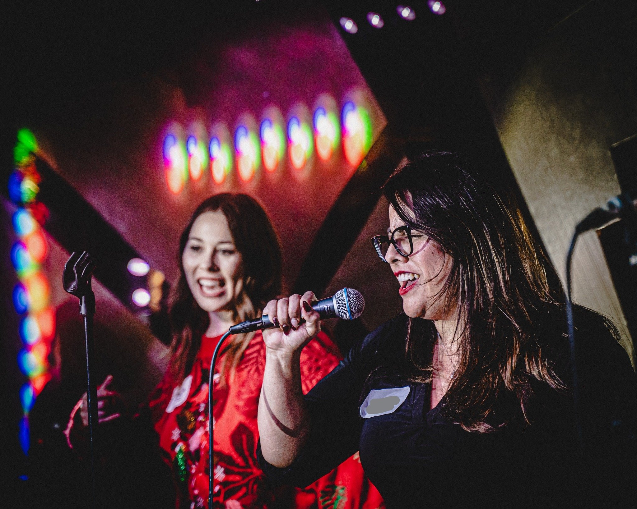 Guitarist playing a solo during a live band karaoke song